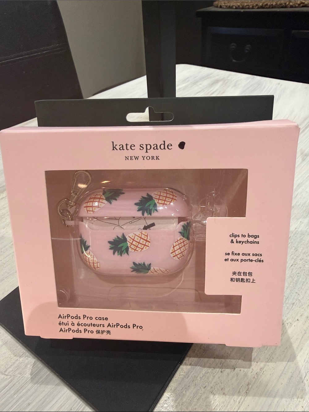 kate spade pink pineapple AirPods Pro case with green leaves and gold clip